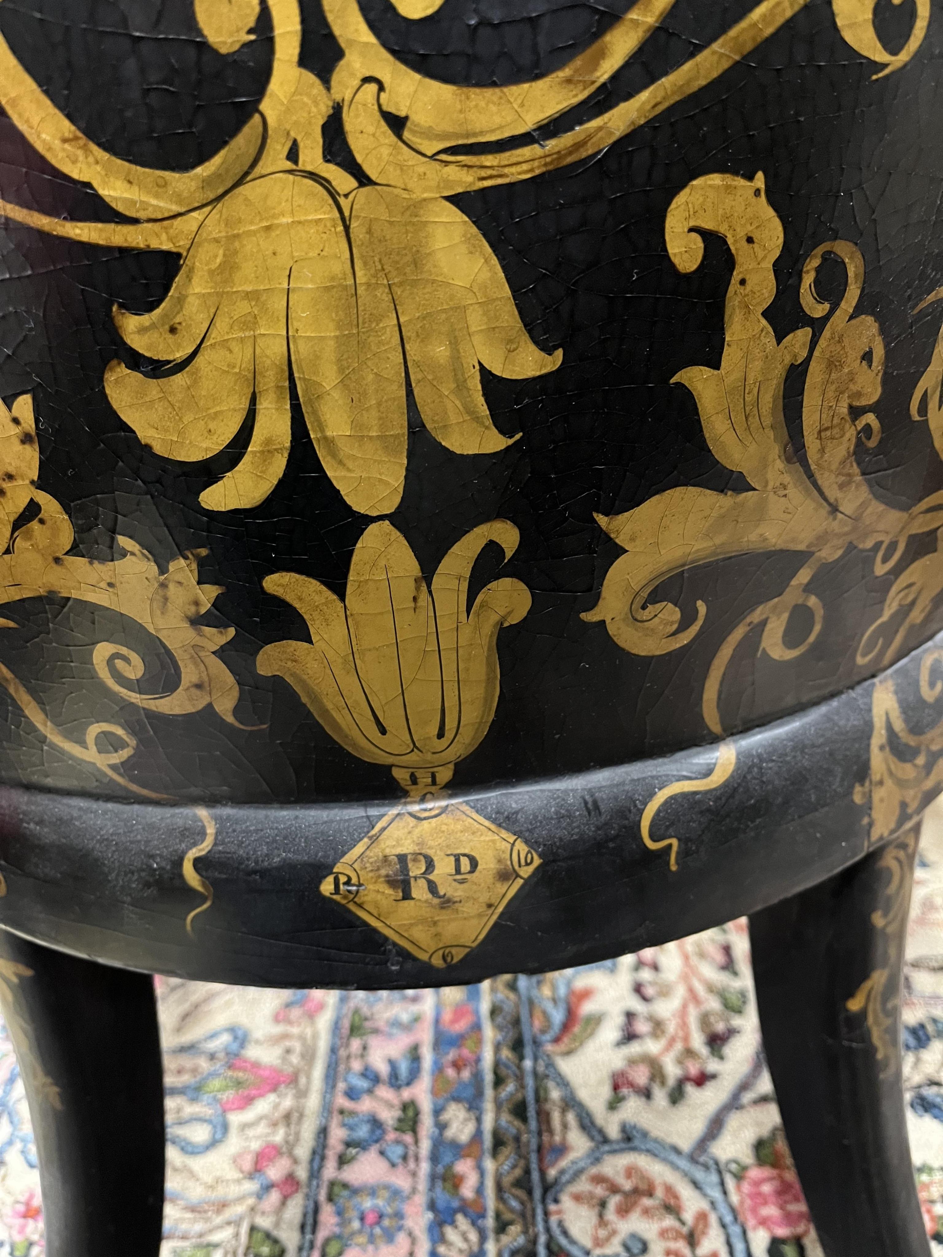 A Victorian papier mache salon chair, with mother of pearl inlay and registration number on the back, width 60cm, height 95cm. Condition - small areas of wear but essentially good condition